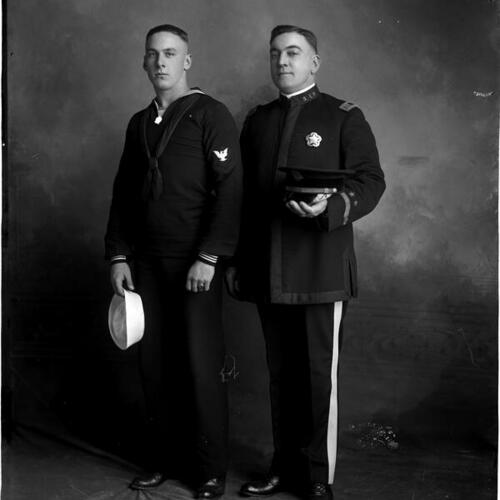 [San Francisco Police Chief D. O'Brien posing with son in naval uniform]