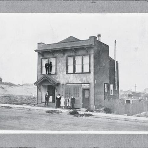 [Linda's grandfather's house on Kirkham Street in 1910 with sand dunes in the background]