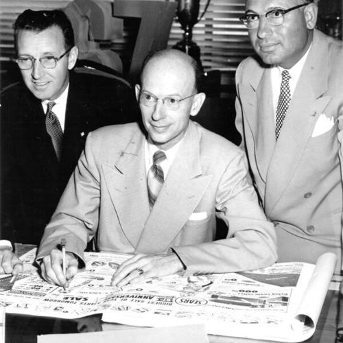 [Arnold Reisner, Burr Strecker and Joe Giacommetti making plans for the Sears, Roebuck & Company's 67th anniversary celebration]