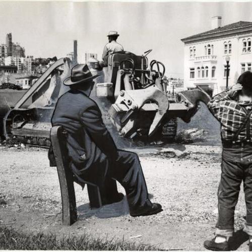 [Two bystanders watch as a bulldozer starts work on a landscaping project in Washington Square Park]