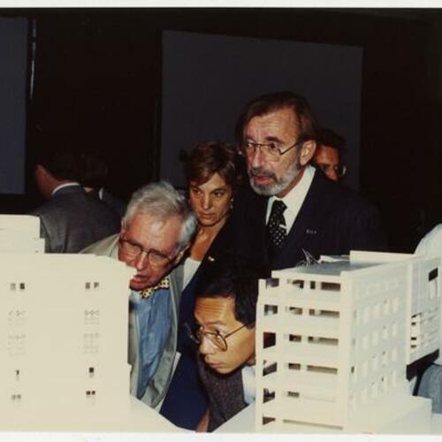 James Ingo Freed (center, right) with others looking at model of the new Main Library