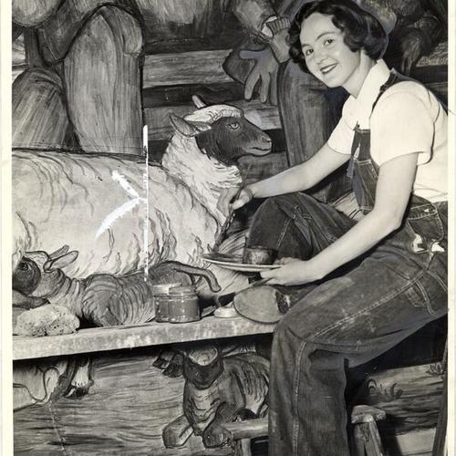 [Una McCann painting a fresco in the cafeteria of the California School of Fine Arts]