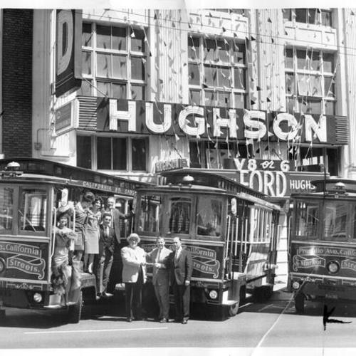 [Motorized cable cars purchased from Hughson Ford being used for promotion purposes]