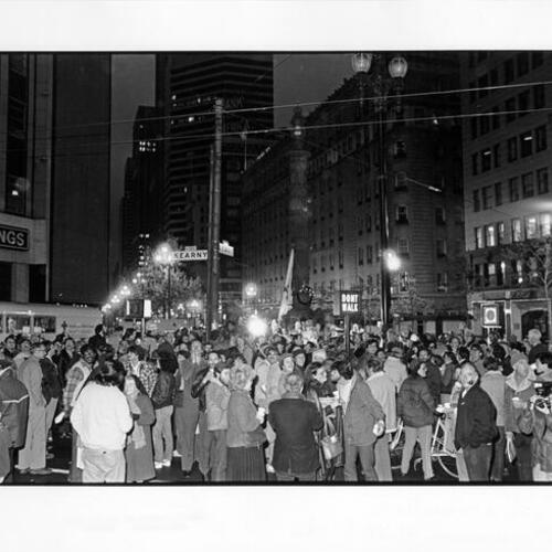 [Crowd of people around Lotta's Fountain, at Third and Market streets, on the 75th anniversary of the 1906 earthquake and fire]