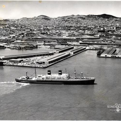 [Aerial view of Mission Rock Terminal looking west with the S. S. President Cleveland in the foreground]
