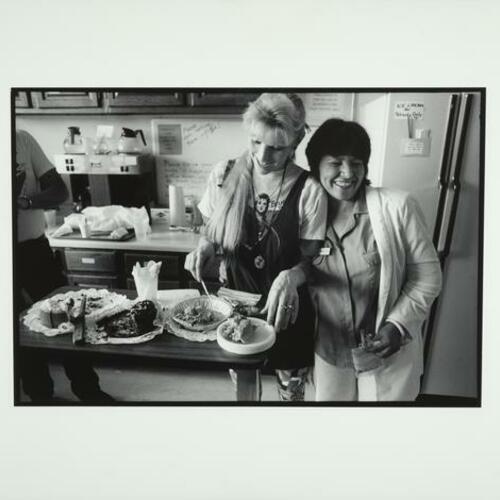 Nurse Isabel McCoy hugs Rita Rockett as she serves dessert