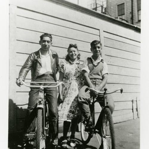 [Ahi and Jesse on bicyles and Sally on Scott Street]