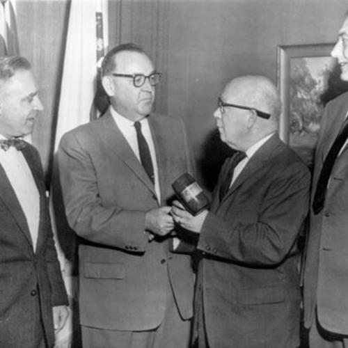 [Governor Edmund Brown receives a redwood gavel at a Greater Highway 36 Association conference]
