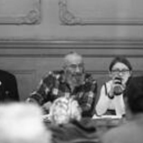 [George Woolf (center) on panel at a meeting of Tenants and Owners in Opposition to Redevelopment (TOOR) at Milner Hotel,