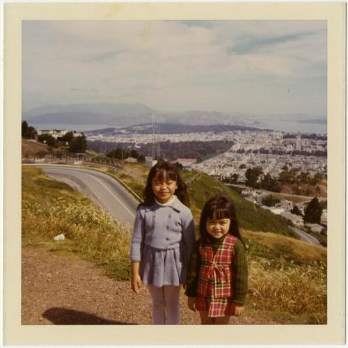 [Bernadette and Bernice posing in front of the view at Twin Peaks]
