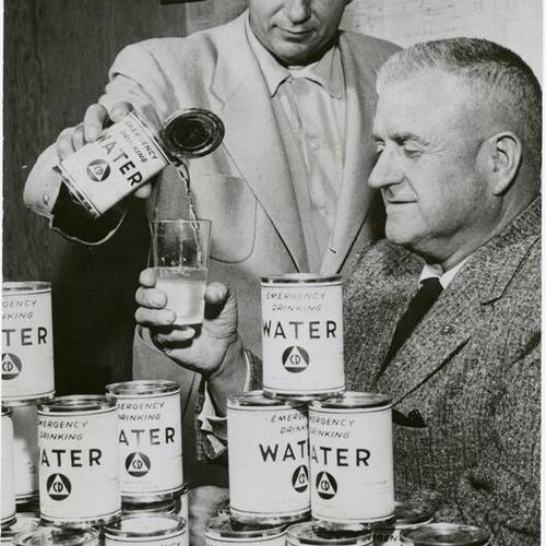 [William Overstreet and H. H. Hearfield, of Sonoma County, sample water canned for civil defense emergencies]