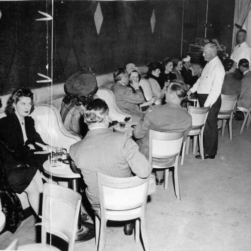 [Customers seated inside the Union Square Lounge]