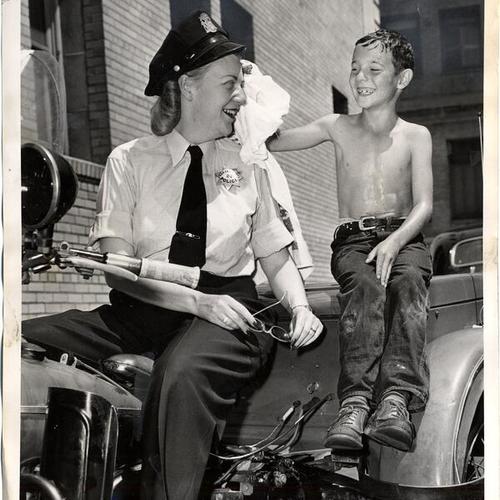[Policewoman Clara Neece and Freddie A. de Maddo]
