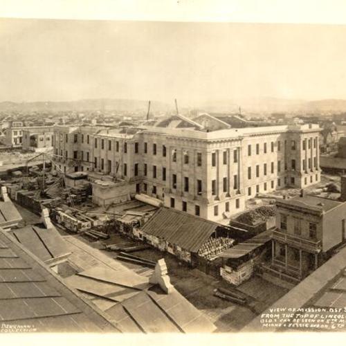 [View from top of Lincoln School building at exterior of old Mint building at Fifth and Mission street during construction]
