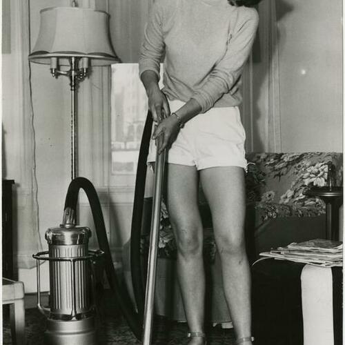 Patricia Sheenan vacuuming