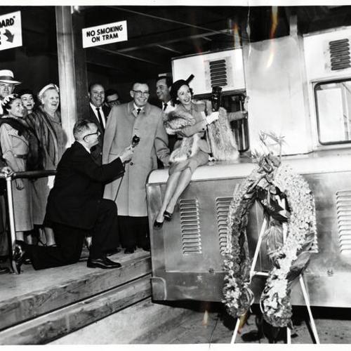 [Dean Maddox, George Whitney and Mrs. Floyd Gilman in front of the Sky Tram]