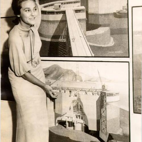 [Eleanor Evans posing with drawings of pier fender used during construction of the Golden Gate Bridge]