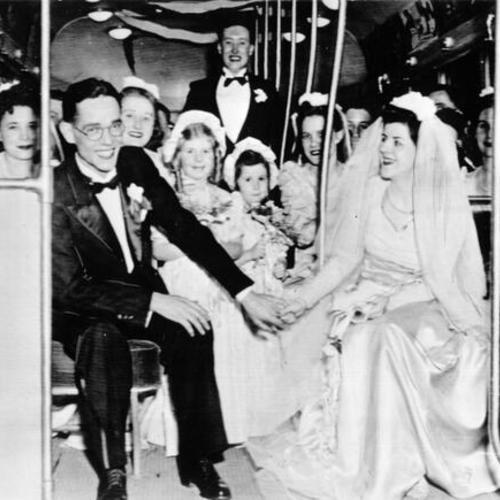 [Wedding party riding a streetcar in Pittsburgh, Pennsylvania]