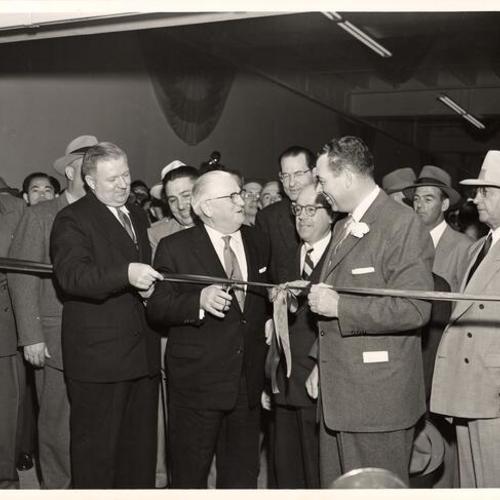 [Jack Shaw, S. E. Onorato (behind Mayor), Mayor Elmer E. Robinson cutting the ribbon to open St. Mary'S Square underground garage, Walter M. Briggs, Ken Royce and B. A. Farletti]