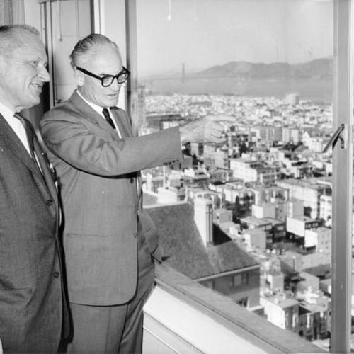 [Former Senator William F. Knowland and Senator Barry Goldwater posing before a window  at the Fairmont Hotel]