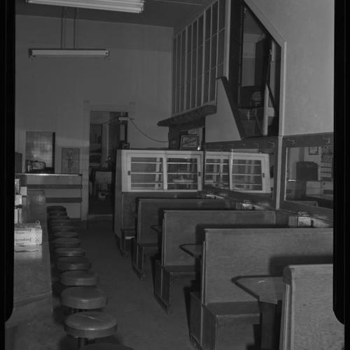 Cafe interior, with lunch counter and booths