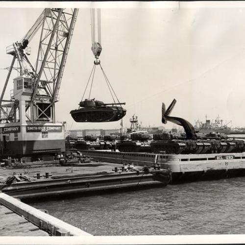 [Tank being loaded onto a barge at the San Francisco Port of Embarkation]