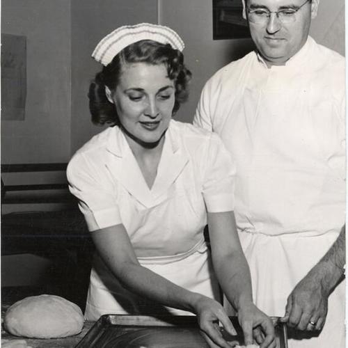 [Instructor George Muller working with student Dorothy Havlish in the Hotel and Restaurant Department at City College of San Francisco]