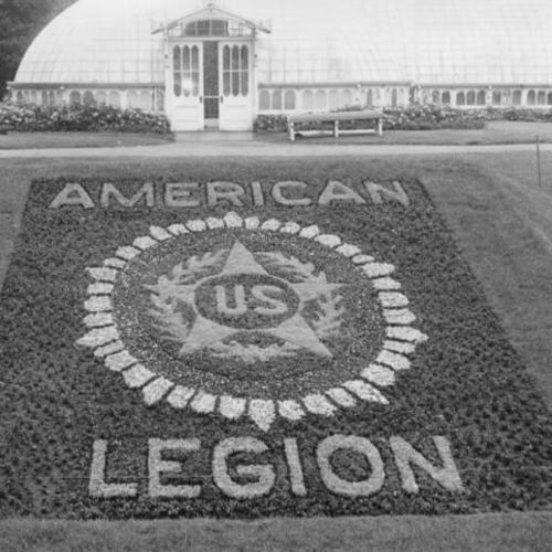 [Floral display showing the American Legion emblem outside the Conservatory of Flowers in Golden Gate Park]
