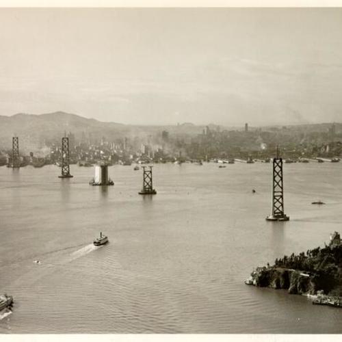 [Aerial view of the San Francisco-Oakland Bay Bridge under construction]