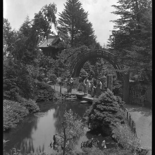 Japanese Tea Garden with people standing in front of pond
