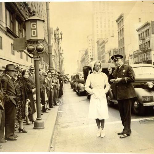 [Lily Anderson and Police Lieutenant J. Casey standing on Market Street]