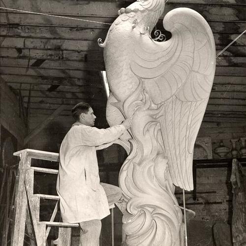[Artist O. C. Malmquist working on a clay model for statue 'Phoenix' to be place atop the Tower of the Sun, Golden Gate International Exposition on Treasure Island]