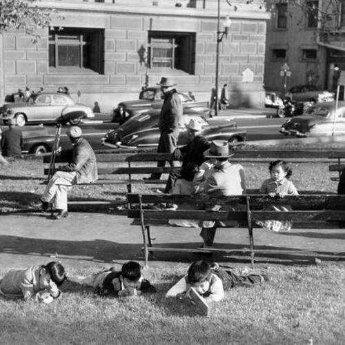 [Children playing on lawn at Portsmouth Plaza]