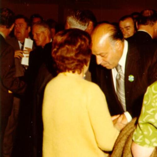 [Joe Alioto, with unidentified female at cocktail party during campaign for mayor]