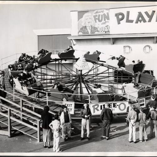 [People waiting in line for the Ridee-O ride at Playland at the Beach]