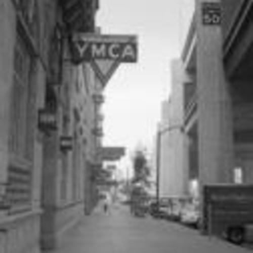 [Hotels and businesses on the 100 block of Embarcadero, including the YMCA and the Embarcadero Freeway]