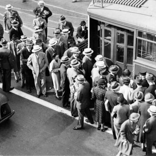 [Passengers boarding a streetcar at 3rd and Townsend streets]