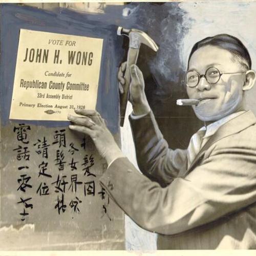 [John H. Wong tacking up a placard to a wall in Chinatown]