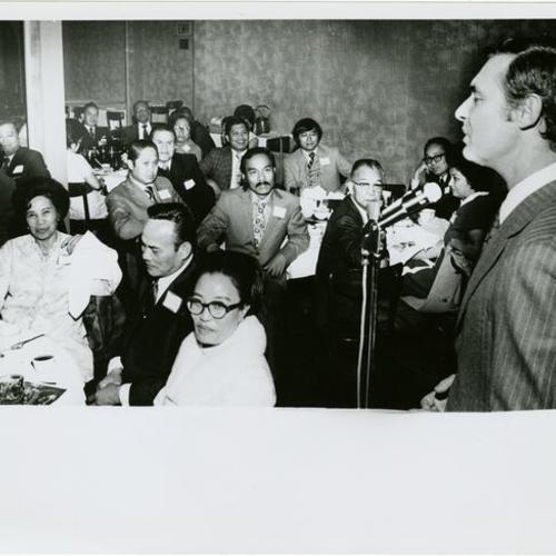[George Moscone speaking at a Filipino event]