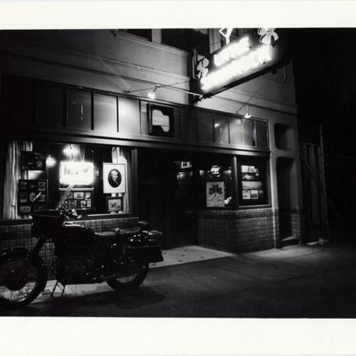 [Motorcycle parked outside of the Little Shamrock bar located at Lincoln and 10 th Avenue]