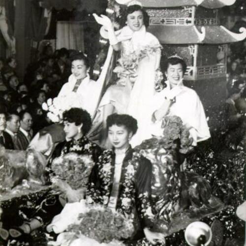 ['Queen' Bernice Wong waving to the crowd of spectators during the New Years parade]