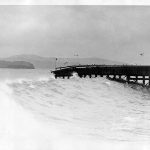[Damaged Golden Gate Bridge trestle bridge is battered by waves]