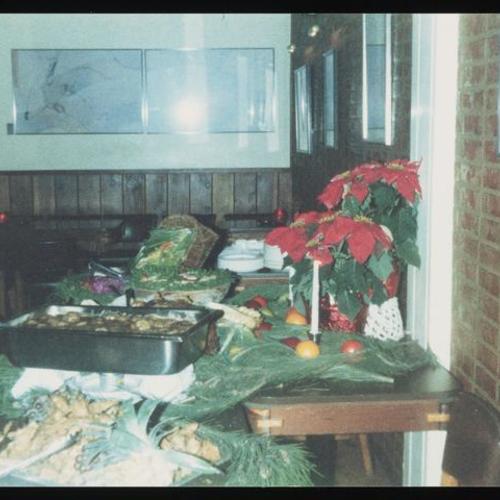View of tabletop with holiday decorations and food