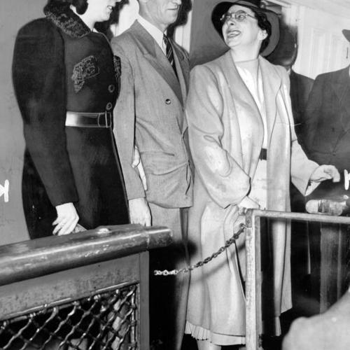 [Harry Bridges accompanied by his daughter Betty Bridges (left) and attorney Carol King to deportation hearing on Angel Island]