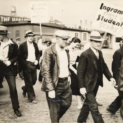 [Longshoremen and supporters marching with picket signs during the strike of 1934]