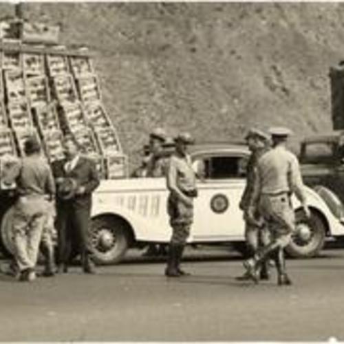 [Police escorting produce trucks into San Francisco during the general strike of 1934]