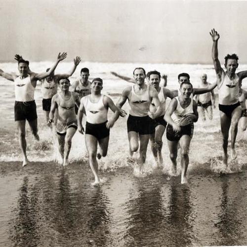 [Members of the Olympic Club swim on New Years Day]