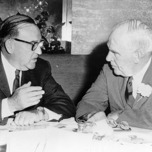[Governor Edmund G. Brown (left) discusses state problems with luncheon guest, Governor Luther H. Hodges of North Carolina]