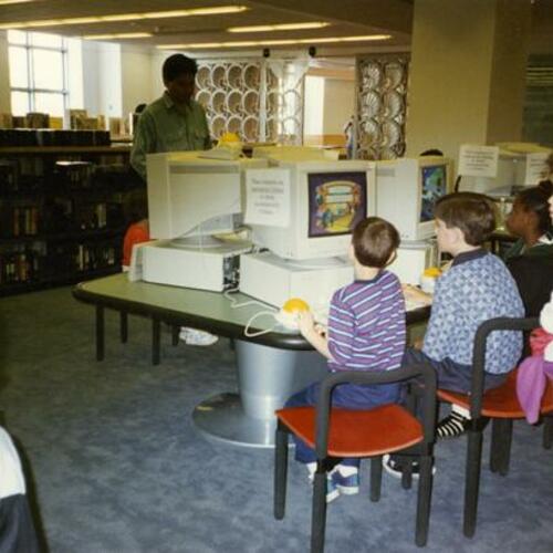 [Children use computers in the Fisher Children's Center of San Francisco Public Library's Main branch]