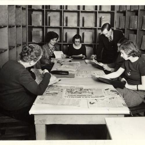 [Dorothy Ford, Maude Enos, William Vaughn, Myrtle Viers, Arline Bowman and Mary Forsman working on book mending and filing project]